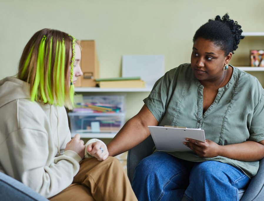 Two women in a health service setting sat down.